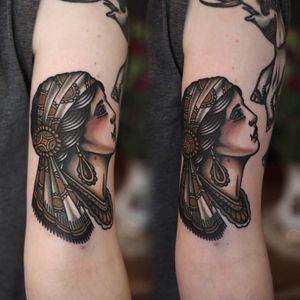 Solid and bold gypsy head tattoo done by Ibi Rothe. #IbiRothe #traditionaltattoo #boldtattoos #gypsy #girlhead