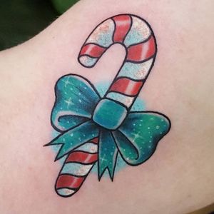 Sparkly bow tied around a candy cane. Tattoo by Holly Dosdale. #bow #christmas #candy #candycane #HollyDosdale