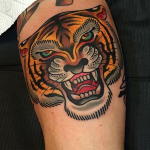 Big and bold tiger head tattoo by Samuele Briganti (IG—samuelebriganti). #bigcats #bold #busts #colorful #fierce #SamueleBriganti #tiger #traditional