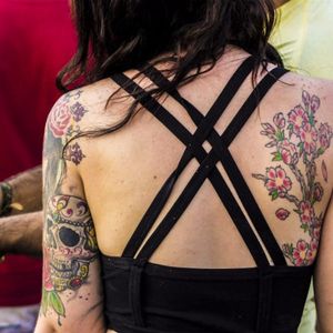 This girl has some preey nice colorful ink, photo by Rodrigo Zaim and Lucas Jacinto #tomorrowlandbrazil #festival #tattoostyle #RodrigoZaim #LucasJacinto #floral #sugarskull