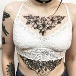 Floral chest piece + sternum tattoo by Vlada Shevchenko. #VladaShevchenko #blackwork #feminine #women #floral #flower #chestpiece #underboob