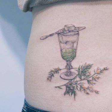 Absinthe tattoo by Baam Kr #Baamkr #Baam #illustrativetattoos #fineline #watercolor #painterly #drawing #watercolor #realism #realistic #absinthe #sugar #floral #leaves #nature #glass #goblet #crystal