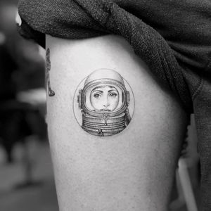 Fornasetti tattoo by Mr K #MrK #cooltattoos #blackandgrey #realism #realistic #illustrative #Fornasetti #ladyhead #portrait #astronaut #small #linework #circle #vintage #tattoooftheday