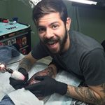 A photograph of Gian Karle Cruz having fun tattooing (IG—giankarle). #GianKarleCruz #InkMaster #neotraditional