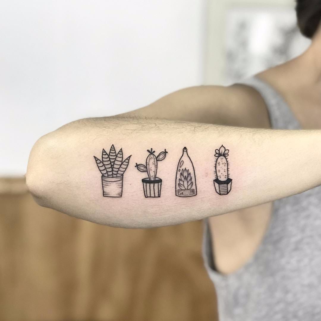 Small cactus and sun tattoo on the upper arm  Tattoogridnet