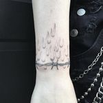 Fine line wristlet by Spider Sinclair on our own @katievidan #SpiderSinclair #fineline #wirstlet #blackandgrey #flame #barbedwire #irony #tattoooftheday