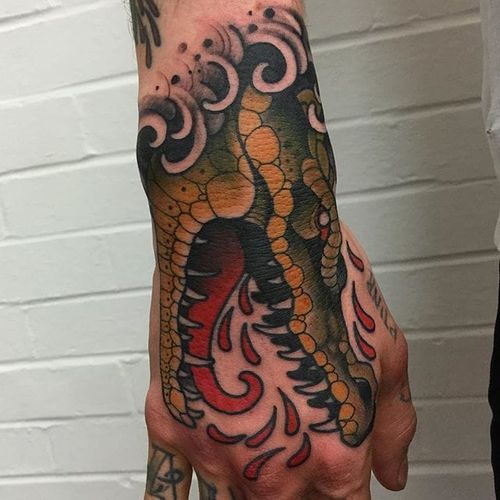 Crocodile Hand Tattoo by Mitchell Allenden #crocodile #crocodiletattoo #neotraditionalcrocodile #hand #handtattoo #handtattoos #neotraditionalhandtattoo #neotraditional #neotraditionaltattoo #neotraditionaltattoos #MitchellAllenden