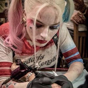 A promotional photo of Margot Robbie as Harley Quinn tattooing someone. #cinema #film #HarleyQuinn #SuicideSquad #tattoosinmovies #tattooedcharacters