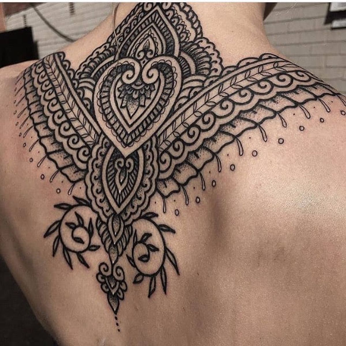 henna mandala on back