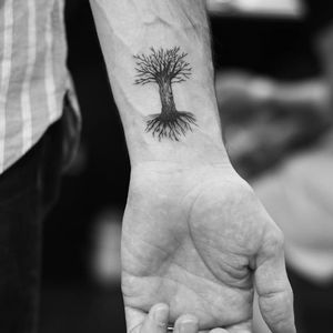 Tree wrist tattoo by Evan Kim #tree #treetattoo #roots #linework #dotshading #blackwork #evantattoo #evankim #West4Tattoo #nyc