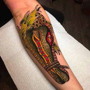Powerful and solid croc head tattoo done by Tom Lortie. #TomLortie #traditionaltattoo #coloredtattoo #crocodile #crochead
