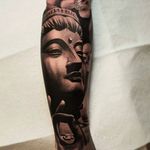Super clean and solid looking Buddha tattoo. #nathanhebert #blackandgrey #buddha #portrait #realism