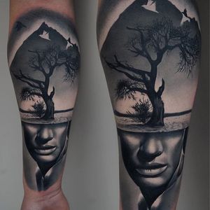 A strange piece of black and grey realism by James Artink (IG— james_artink). #blackandgrey #JamesArink #ladyhead #landscape #realism #surreal #tree