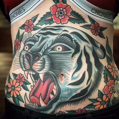 Panther tattoo by Jesse Gordon #JesseGordon #colortattoo #traditional #tiger #junglecat #cat #kitty #flowers #daisy #leaves #nature #wildlife #besttattoos #tattoooftheday