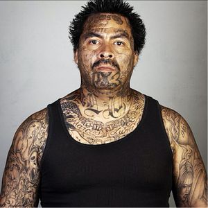 A photo by Steve Burton of a gang member with tattoos. #gangtattoos #photography #Photoshop #SkinDeep #SteveBurton #tattooremoval