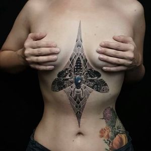 Solid moth tattoo with some detail in the back. Amazing work by Coen Mitchell. #coenmitchell #details #geometric