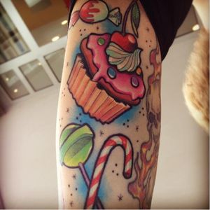 Awesome contrast to a flaming skull tattoo nice and sweet #candytattoo #lollipop #sweet #cupcake #candycane