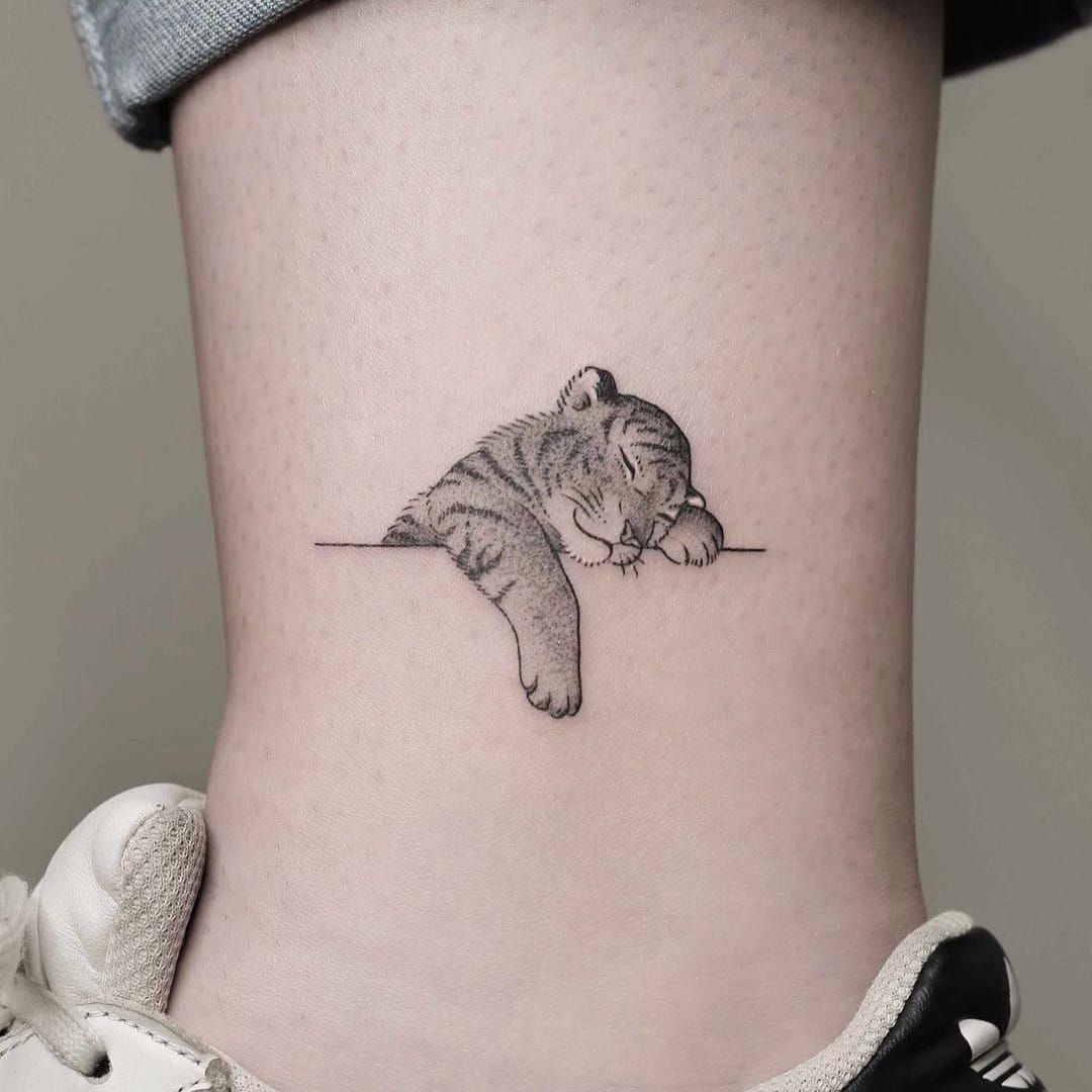12 Minimalist Tiger Tattoo Ideas That Will Inspire You To Get Inked  Cubs  tattoo Tiger tattoo Leopard tattoos