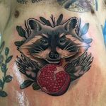 Raccoon cradling a pomegranate, by Roger Mares. (via IG—mares_tattooist) #neotraditional #animals #creatures #quirky #rogermares