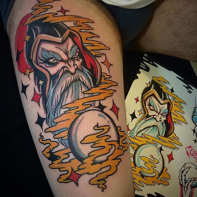 Grey Ink Wizard Tattoo On Arm by Gettattoo