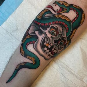Traditional snake and skull tattoo by Travis Costello. #traditional #TravisCostello #snake #skull