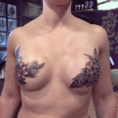Gorgeous mastectomy scar cover up by Ryan Ashley Malarkey #ryanashleymalarkey #mastectomytattoo #coverup #scarcoverup #flowers #butterfly #blackandgrey #realism #tattoooftheday