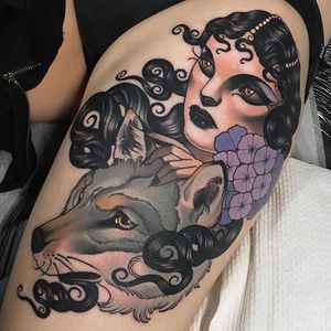 Woman, wolf and flowers neo traditional thigh piece by Emily Rose Murray. #neotraditional #artnouveau #EmilyRoseMurray #wolf #woman #flowers
