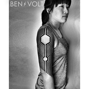Clean and solid geometric black sleeve tattoo by Ben Volt. #benvolt #black #geometric #tattoo
