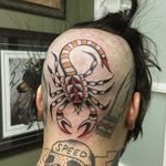 An intense head tattoo of a scorpion by Tommy Doom (IG—tommydoom). #scorpion #TommyDoom #traditional