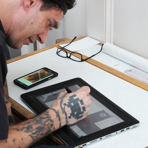 Anonymous Tattoo's resident artist Clay McCay working diligently on a Cintiq tablet. (Photo by kd diamond) #ClayMcCay #AnonymousTattoo #SavannahGeorgia #Georgia #WeirdTraditional