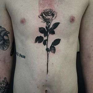 Rose tattoo by Pari Corbitt. #PariCorbitt #rose #blackandgrey #longstemmedrose