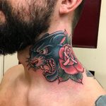 Tattoo by Tim Hendricks #TimHendricks #selftaughttattooartists #color #traditional #panther #rose #leaves #flower #floral #necktattoo #junglecat