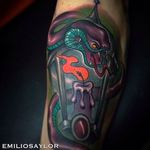 Awesome use of colors in this snake and lamp tattoo done by Emilio Saylor. #emiliosaylor #snake #lamp #neotraditional