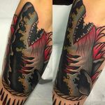 Gruesome looking shark tattoo with solid colors and clean lines! Tattoo by Kike Esteras. #KikeEsteras #shark #blackandred #animaltattoos