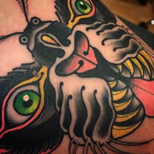 A close up of Scott Garitson's (IG—scottgaritsontattoo) crazy tiger moth tattoo. #moth #ScottGaritson #surreal #tiger #traditional #vibrant