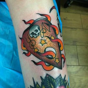 A flaming wooden pick tattoo by Dan Hartley. #DanHartley #TripleSixStudios #NeoTraditional #skull #flaming #pick