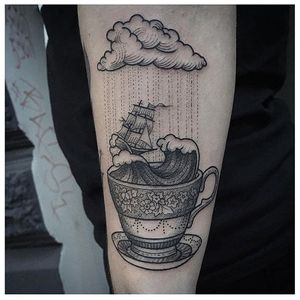 Storm in a teacup tattoo by Susanne König. #storminateacup #storm #teacup #ship #tea #cup #wave #blackwork #susannekonig