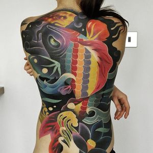 Marcin Aleksander Surowiec's surreal spin on Irezumi in this back-piece of a koi. #backpiece #koi  #lotus #MarcinAleksanderSurowiec #surreal