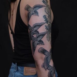 birds flying tattoo arm