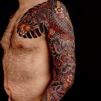 Incredible dragon sleeve by R G #rg74 #japanese #dragon #cherryblossoms #color #tattoooftheday