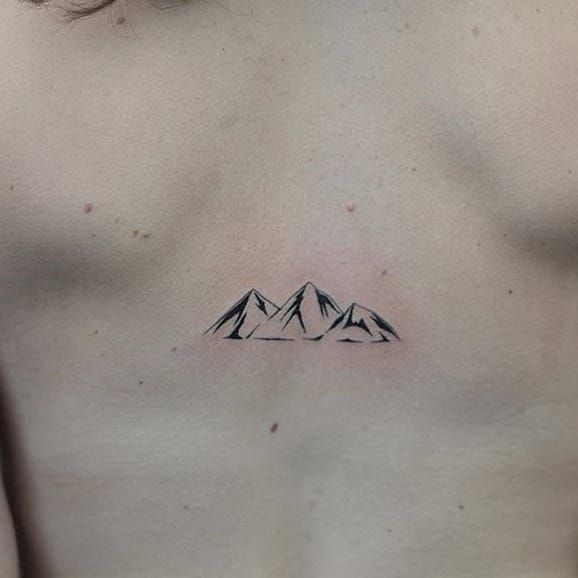 Showcase your adventurous spirit with a mountain range tattoo