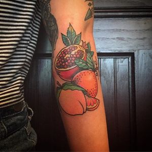 The three blessed fruits in Buddhism: pomegranate, grapefruit and peach. Tattoo by DUSTO. #traditional #fruit #Buddhism #pomegranate #grapefruit #peach #DUSTO