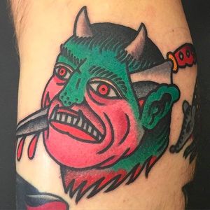 Not the usual but a super cool looking demon head tattoo by Tomas Garcia. #TomasGarcia #dagger #colortattoo #neotraditional #demon