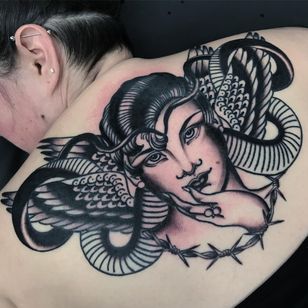 Back piece tattoo by Katie Gray #KatieGray #blackandgrey #traditional #portrait #ladyhead #wings #feathers #snake #reptile #barbedwire #oldschool