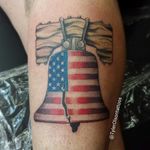 A flag draped liberty bell by Tyler Olson. (Via IG - tylerolsontattoos)