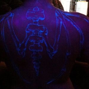 UV tattoo. Unknown artist #spine #back #skeleton #uv #wings #bones