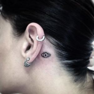 Subtle behind-the-ear tattoo by Wild and Wicked Tattoo. #ear #behindtheear #eye #microtattoo #subtle #minimalist #WildandWickedTattoo