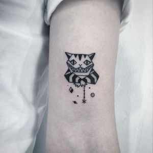 Cheshire Cat tattoo by Greem. #southkorean #blackwork #edged #geometric #Greem #cheshirecat #aliceinwonderland #cat
