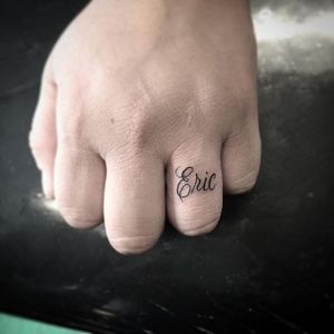 Eric. #BooBooNegrete #blackandgrey #lettering #eric #ring #name #microtattoo #script #lettering