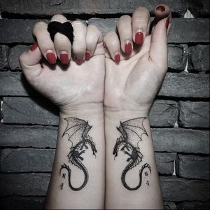 Matching dragon wrist tattoos by Kim HeyMin. #KimHeyMin #dotwork #fine #pointillism #dragon #matchingtattoos